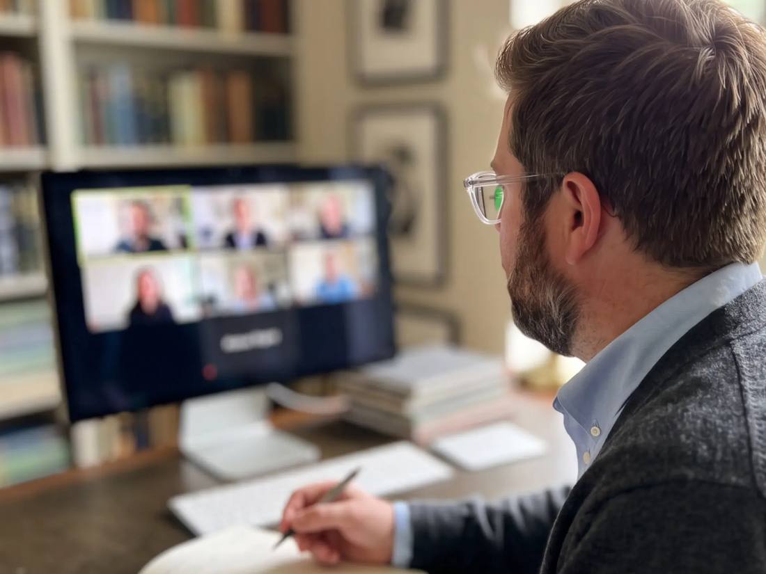 Tanner O. Campbell taking notes during a group coaching video call